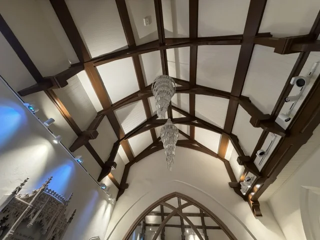 Restored timber roof and lighting within the side chapel