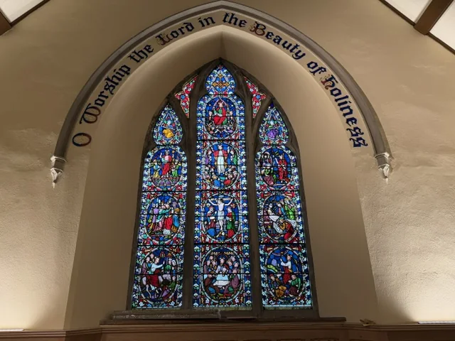 Restored stained-glass chancel window at All Saints Parish Church