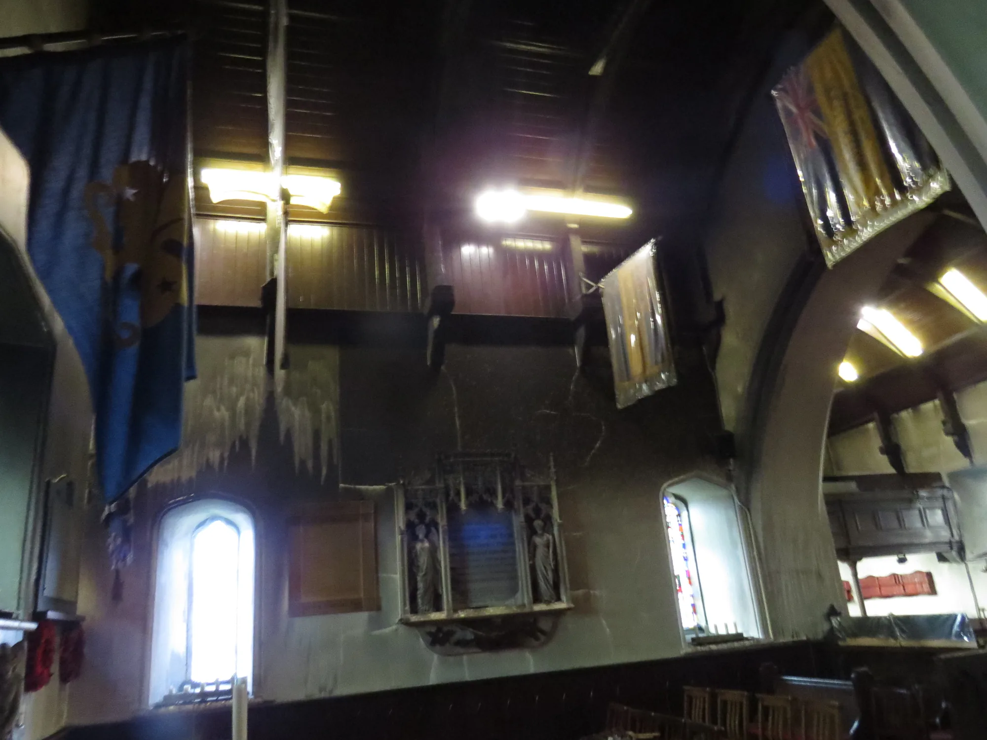 High-level soot contamination across the church interior