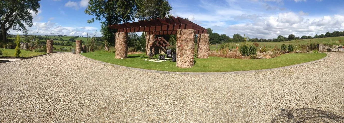 Landscaped gardens and stone-column pergola