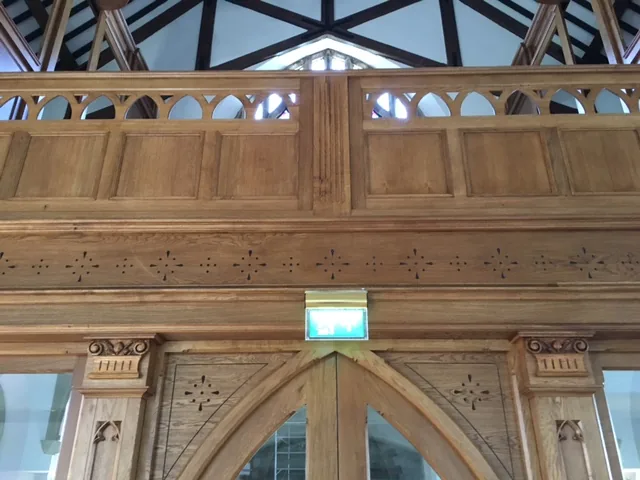 Restored carved timber screen at St Colman’s