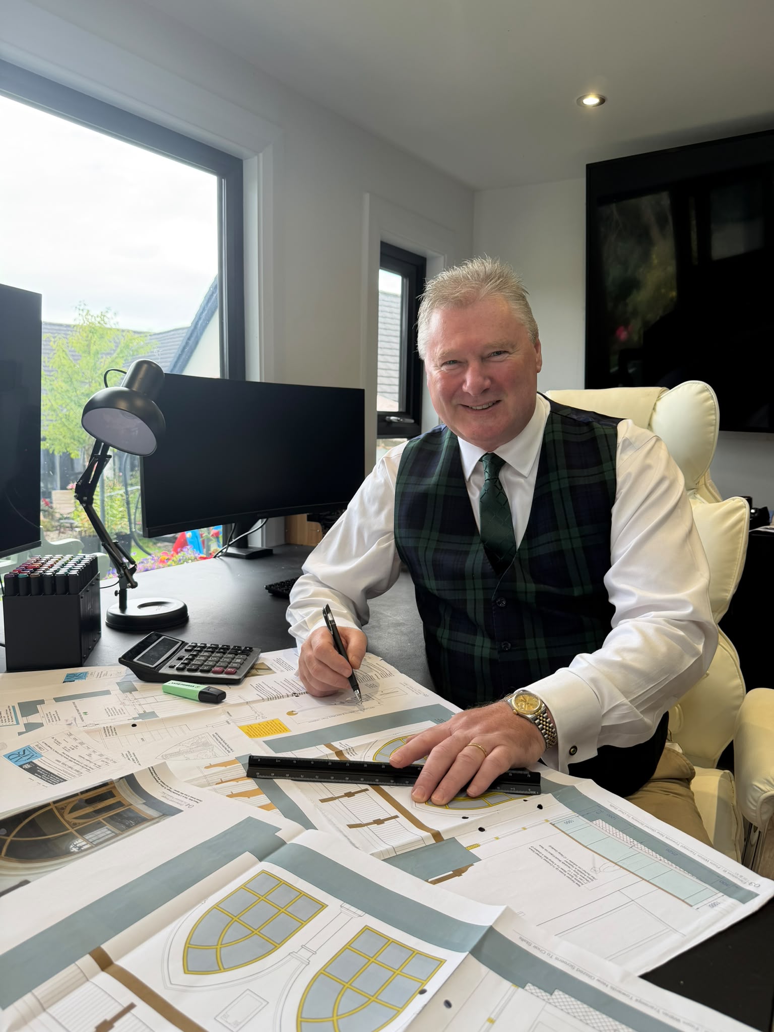 Ian Maconachie at his desk